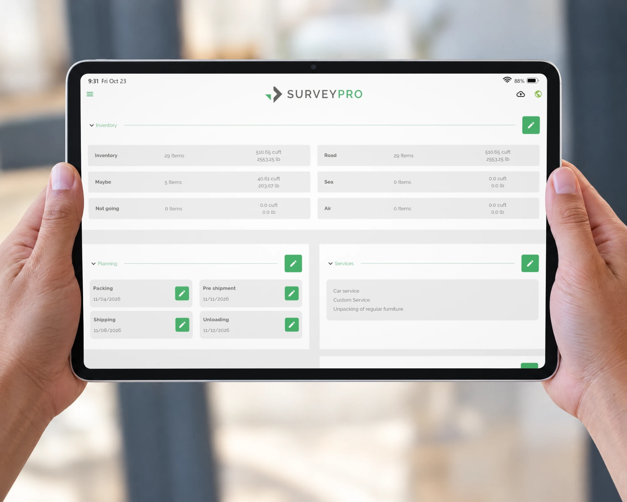 Hands holding a tablet with the SurveyPro move overview: inventory of 29 items at 510.65 cuft, planning dates and booked services
