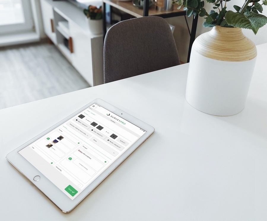 An iPad running SurveyPro on a table in a customer's living room